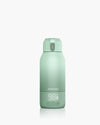 Momcozy portable breast milk warmer, mint green, LCD display 98°F, ideal for travel and quick warming.