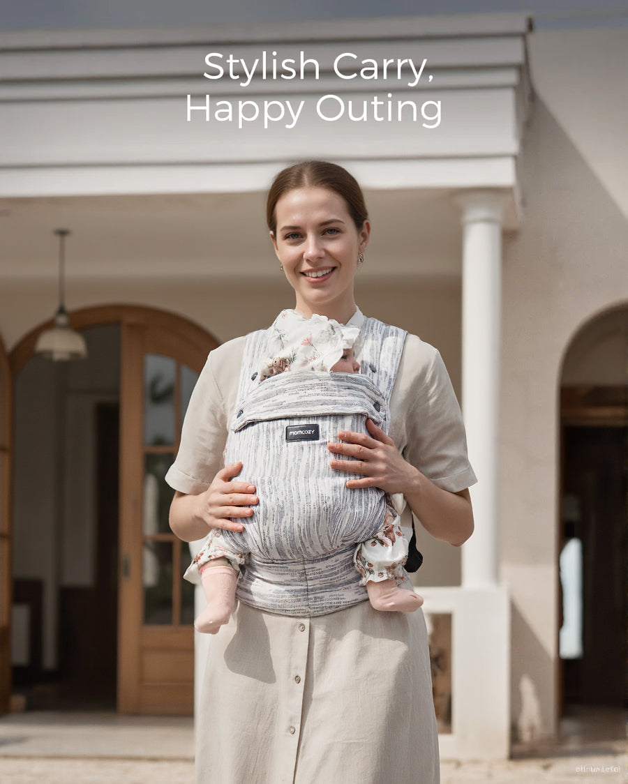 Momcozy PureHug baby carrier, stylish design in action. Mother babywearing with a happy baby for a stylish outing.