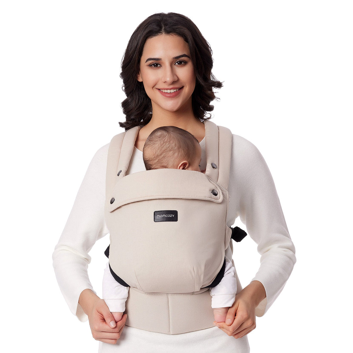 Momcozy PureHug baby carrier in cream color, comfortable design, babywearing by mother, with Momcozy logo.