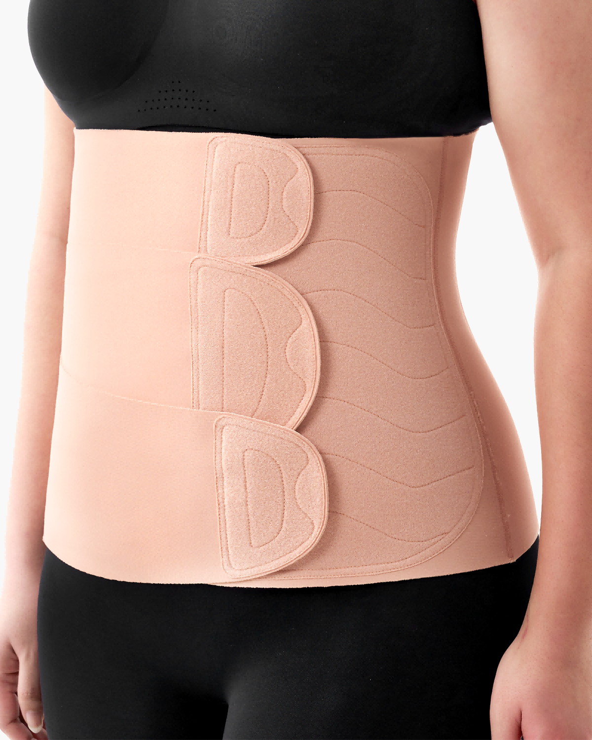 Momcozy Ergowrap Postpartum Belly Band in oyster pink, worn for postpartum support, adjustable straps