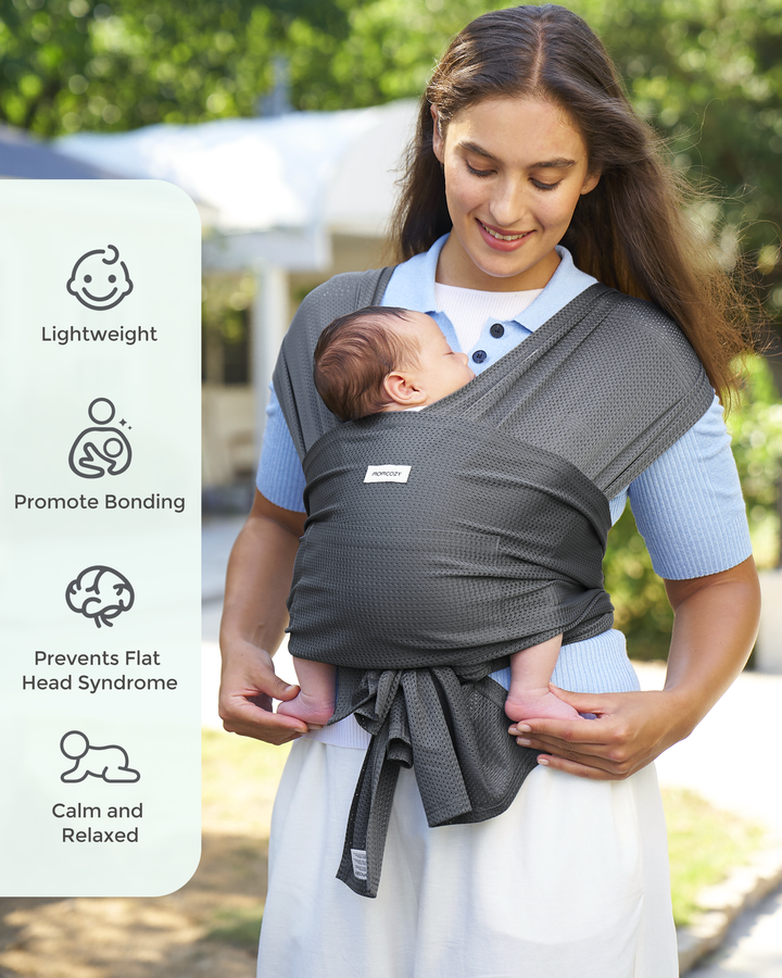 Momcozy gray baby wrap carrier, hands-free babywearing, promotes bonding, lightweight design for baby's comfort.