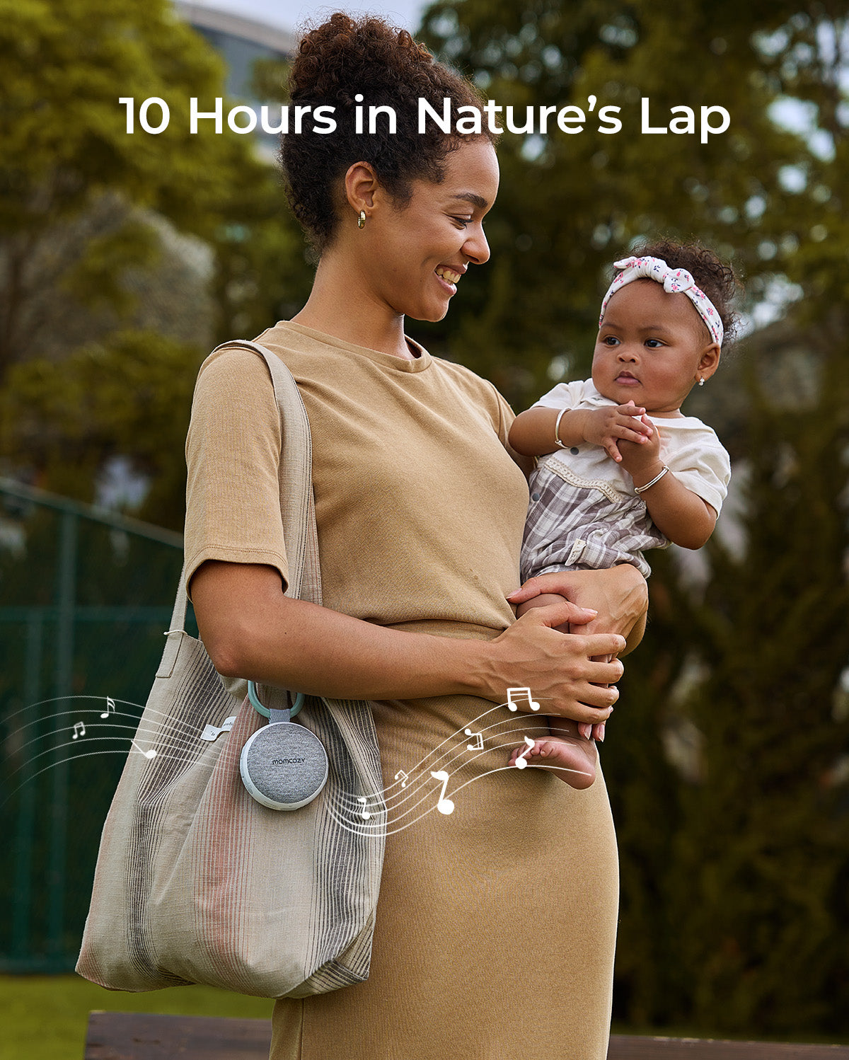 Momcozy portable sound machine with baby, offering nature sounds for 10 hours, promoting baby's sleep and relaxation.