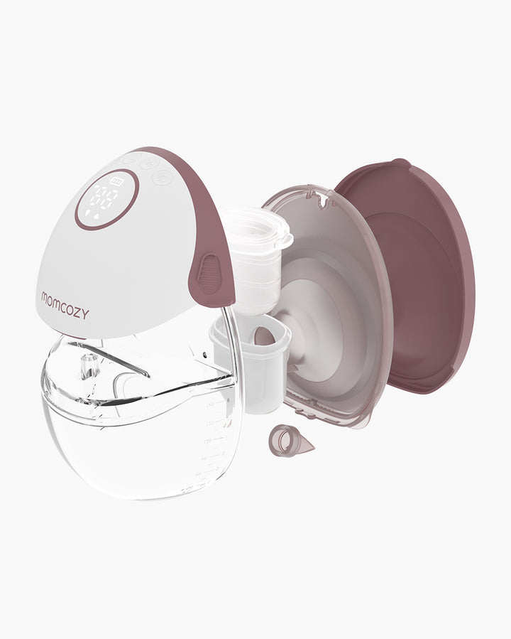 Momcozy M6 hands-free breast pump parts showing clear milk collector and purple accessories.