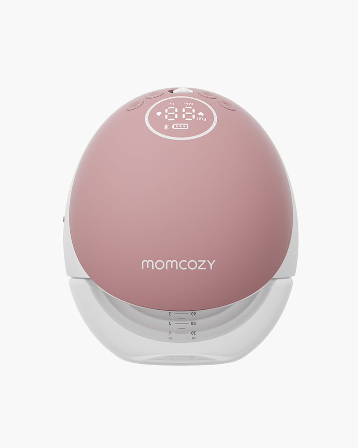 Momcozy Mobile Flow™ hands-free breast pump in pink with a streamlined design, body featuring a display screen and a transparent bottle for clear milk level monitoring.