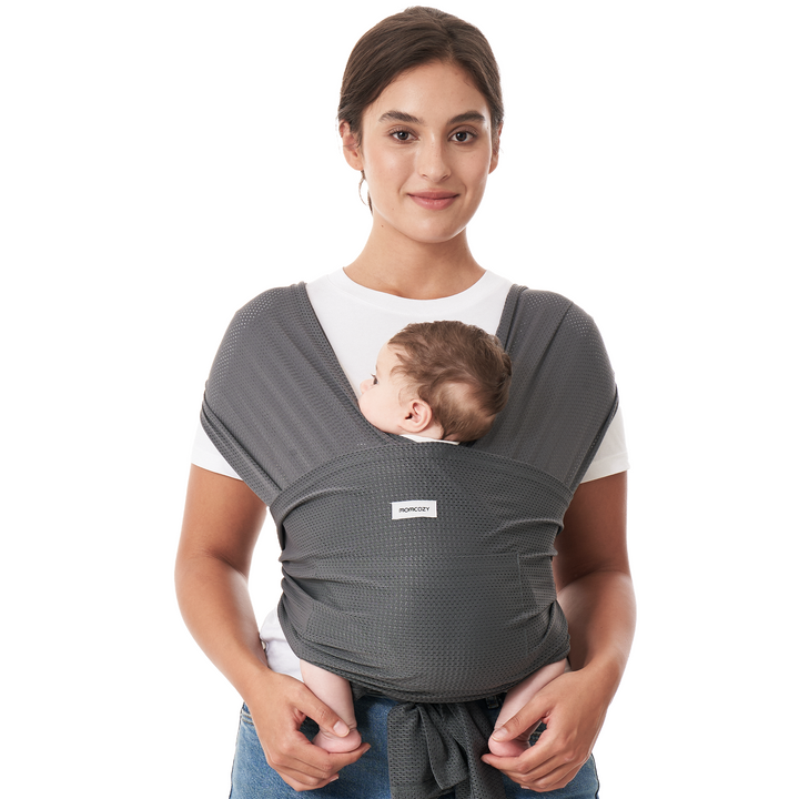 Momcozy gray baby wrap carrier, comfortable hands-free design for babywearing and bonding.