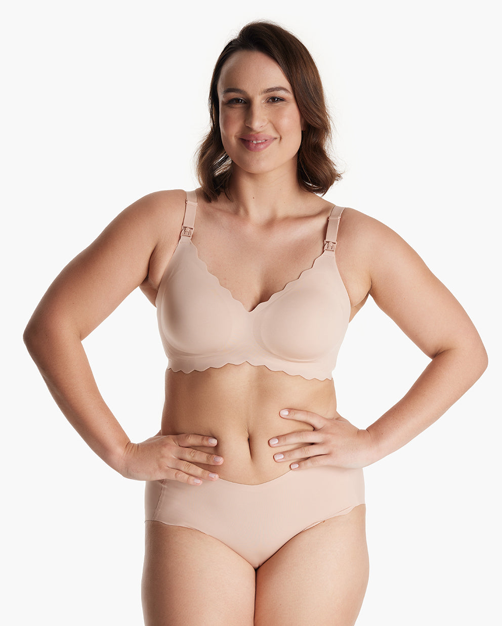 Woman in beige Jelly Strip Seamless Nursing Bra YN46 & briefs. Shows scalloped trim, visible M9 Pump nursing clips.